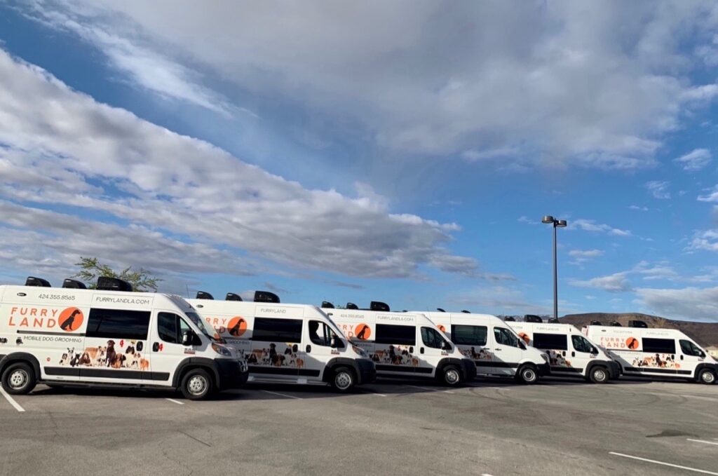 Mobile grooming trucks lined up
